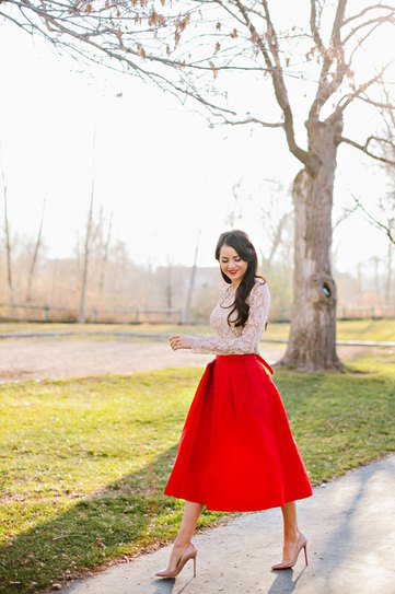 white lace blouse with red midi taffeta extended skirt