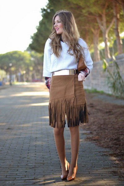 white knitted sweater with metal belt and knee length French skirt