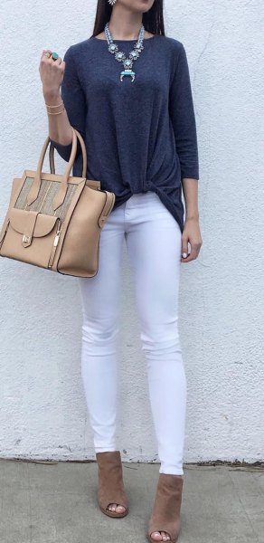 dark gray tri-colored top with white jeans and open toe boots