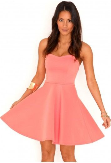 pink fit and flare strapless mini dress with gold cuff bracelet