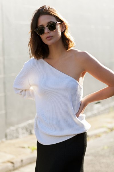 white ribbed shoulder sweater with black mini skirt