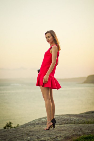 red fishtail mini sleeveless dress with black heels