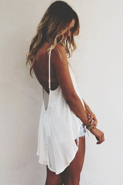 white floating backless high low tank top with denim shorts