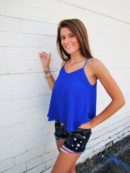 royal blue floating tank top with black embroidered mini denim shorts