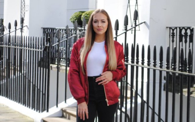 red jacket with white fit and black high waist jeans