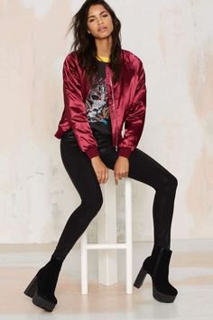dark red bomber jacket with black print tee and slim jeans