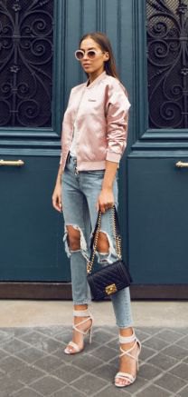 light pink satin bomber jacket with hard ripped cropped jeans