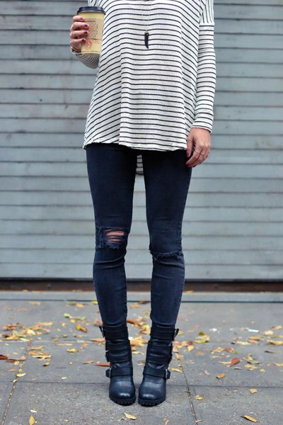 black and white striped long sleeve tee with dark blue ripped moto-jeans