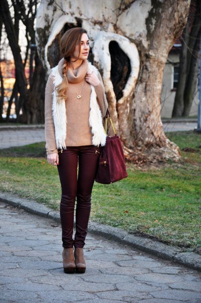 black coated jeans with pink pink sweater and white vest