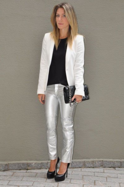 white blazer with black top on neck and silver metallic jeans