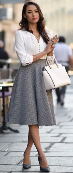 white button up v-neck blouse with gray plated midi-flared skirt