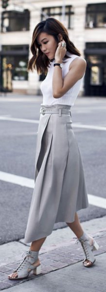 white sleeveless blouse with gray pleated midi skirt