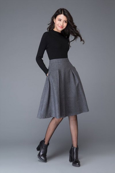 black shape that fits long sleeved tee with midi gray blown wool skirt