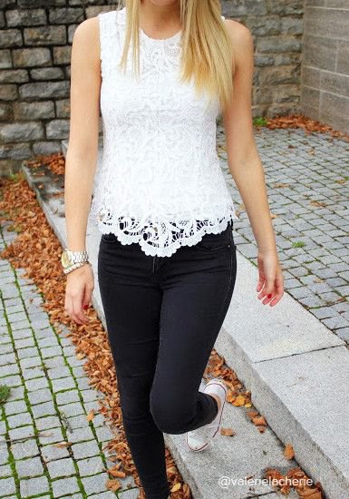 white seashell in lace case with black skinny jeans