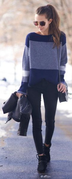 navy and light blue color block sweater with black jeans