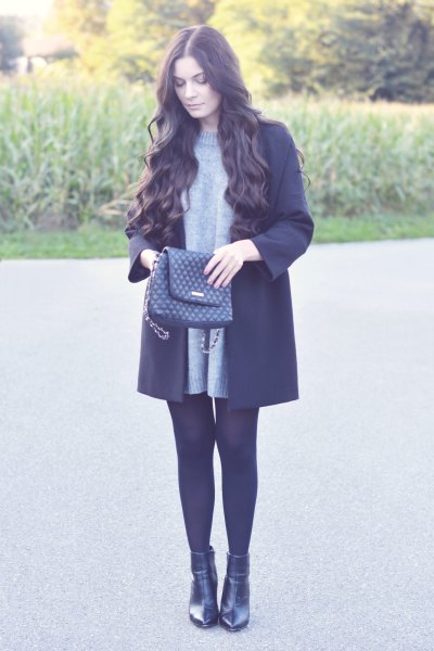 crew neck sweater with black wool coat and leather shoes
