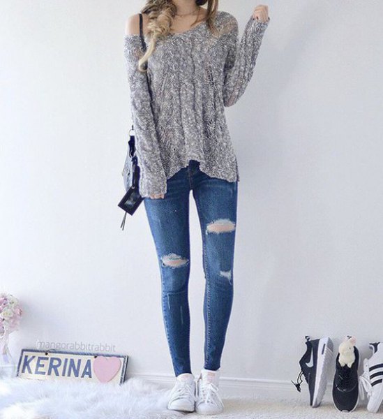 heather gray a shoulder knit sweater with blue ripped skinny jeans