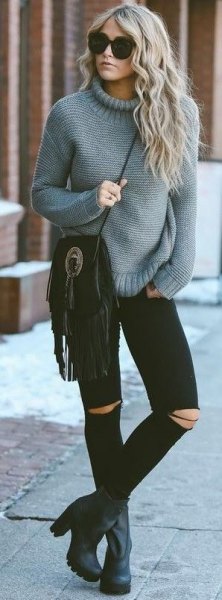 gray suede chunky knit sweater with black ripped skinny jeans