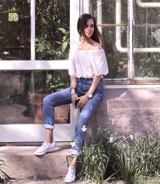 white from shoulder lace top with cuffed jeans and sneakers