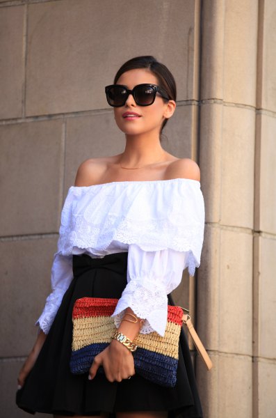 of the shoulder blouse with navy high waist flared mini skirt