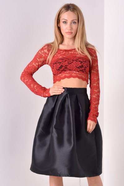 red long sleeve shape crop with black flared midi skirt