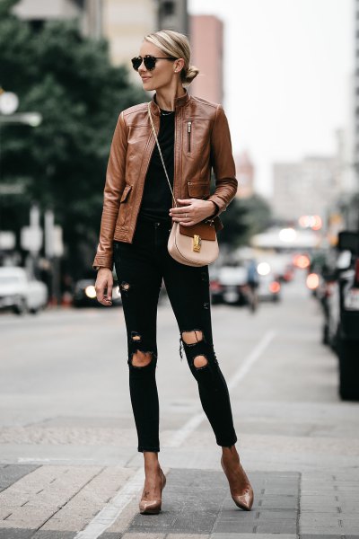 brown leather jacket with black ripped slim jeans