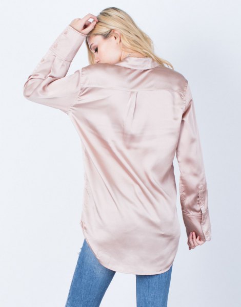 pink gold oversized button silk shirt with blue jeans