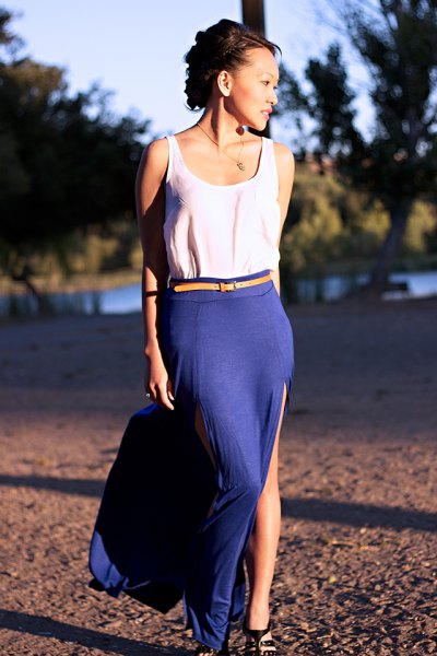 white top with yellow belt and blue high split skirt