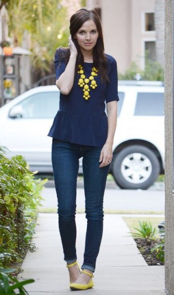 navy blue peplum top with yellow statement necklace