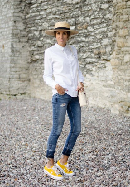 white button up shirt with cuffed jeans and yellow sneakers