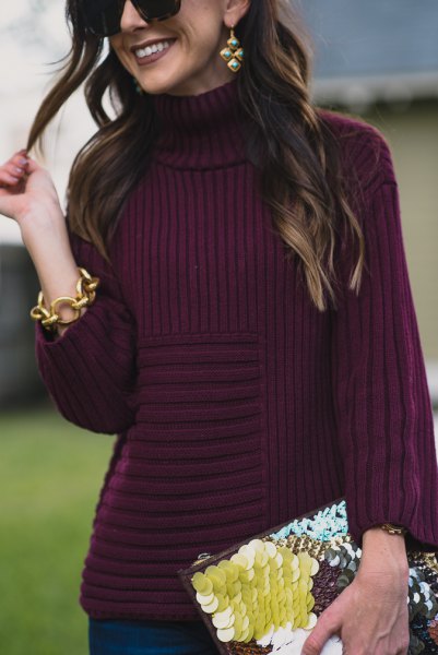 purple turtleneck knitted sweater with black and yellow clutch bag