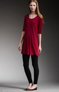 red half-heated tunic with black leggings and flats
