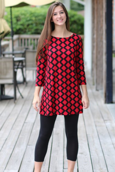 red and black patterned top with cropped leggings