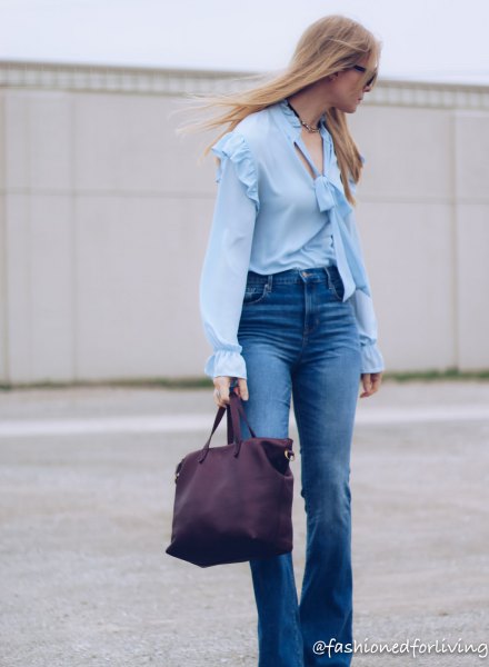 ruffle shoulder puff sleeve light blue blouse with puffed jeans