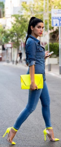 dark blue chambray button up shirt with yellow clutch bag and matching high heels