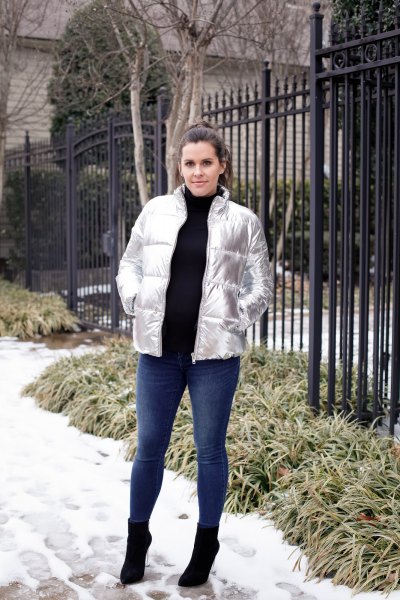 silver metallic down jacket with black sweater