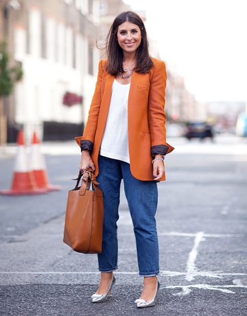 orange long blazer with white vest top and wide leg mom jeans