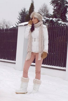 white down jacket with light gray knitted scarf and snow boots made of faux fur