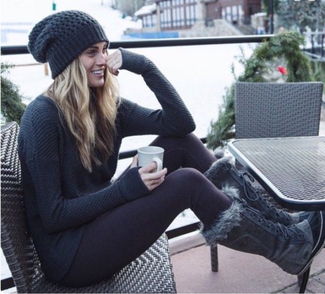 black knitted hat with matching sweater and knee-high snow boots
