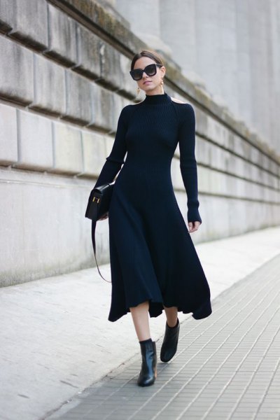 black form fitting puffy midi dress with ankle boots