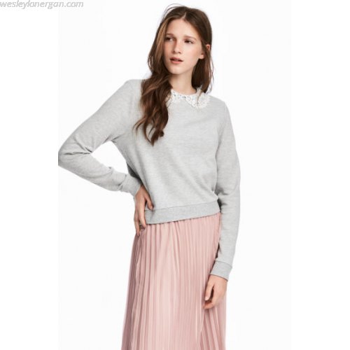 gray sweater with light pink pleated midi skirt
