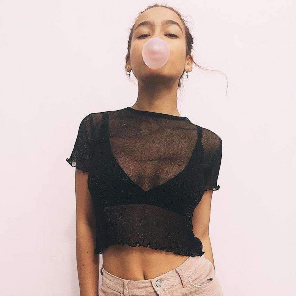 shape fitting black crop top with light pink skinny jeans