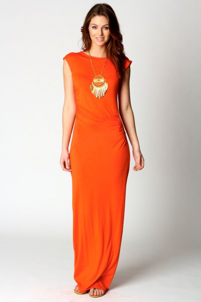 orange cap sleeve dress with boho style statement necklace
