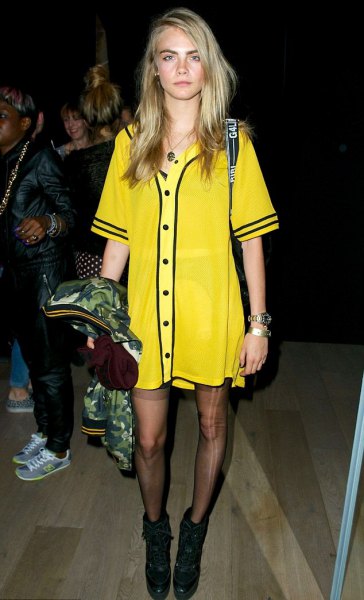 yellow and black printed t-shirt dress with socks and boots