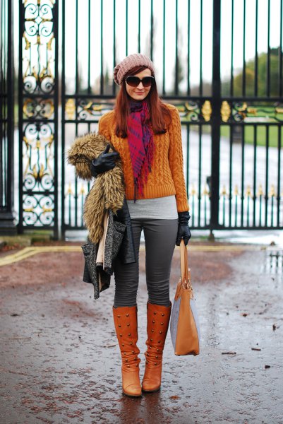 orange knitted sweater with matching knee-high boots