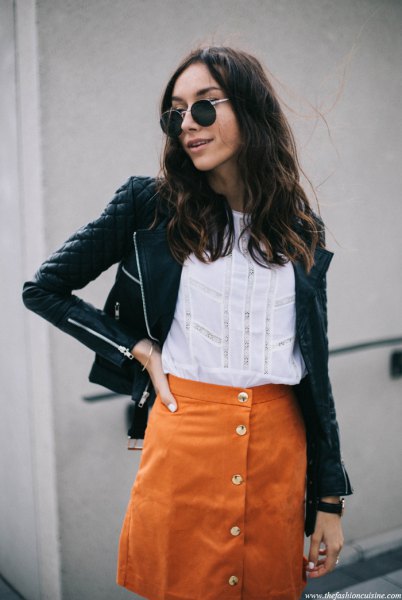 black quilted leather jacket with orange suede button front skirt