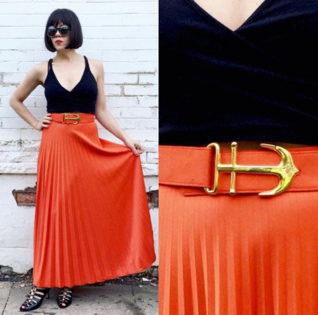 black deep v-top with top with orange pleated maxi skirt