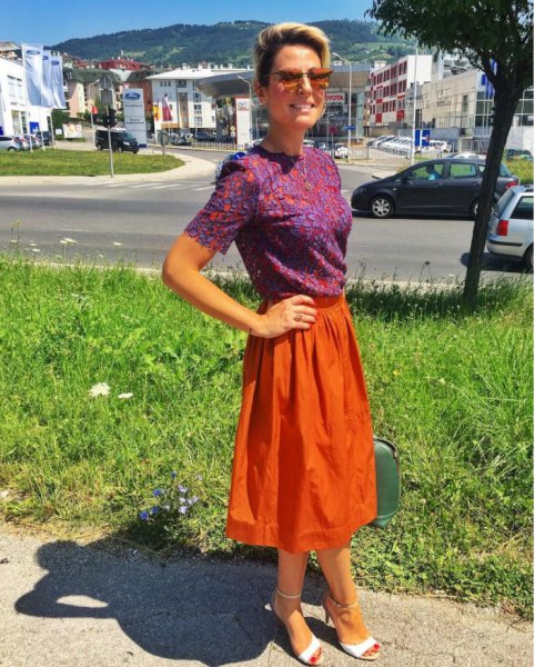 blue printed short sleeved blouse with orange midi skirt