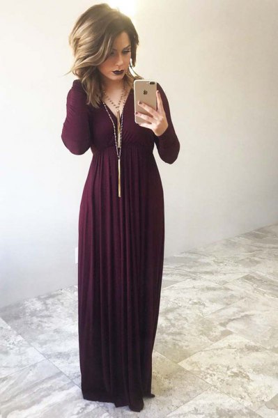 maxi dress with long sleeves and long fringed necklace
