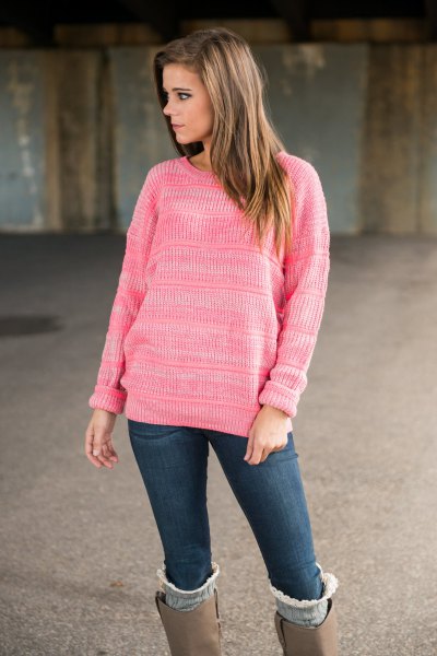 pink knitted sweater with gray suede high boots